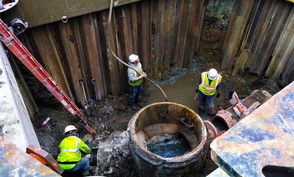 Men installing underground utilities